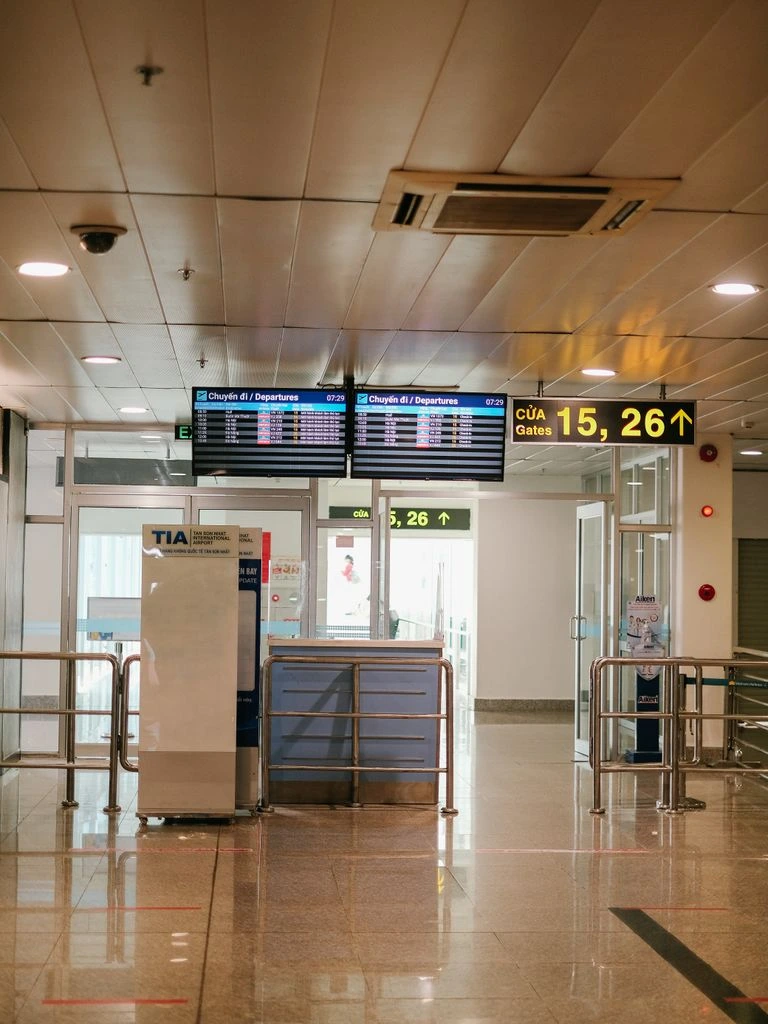 A premium digital advertising panel inside a modern airport terminal.